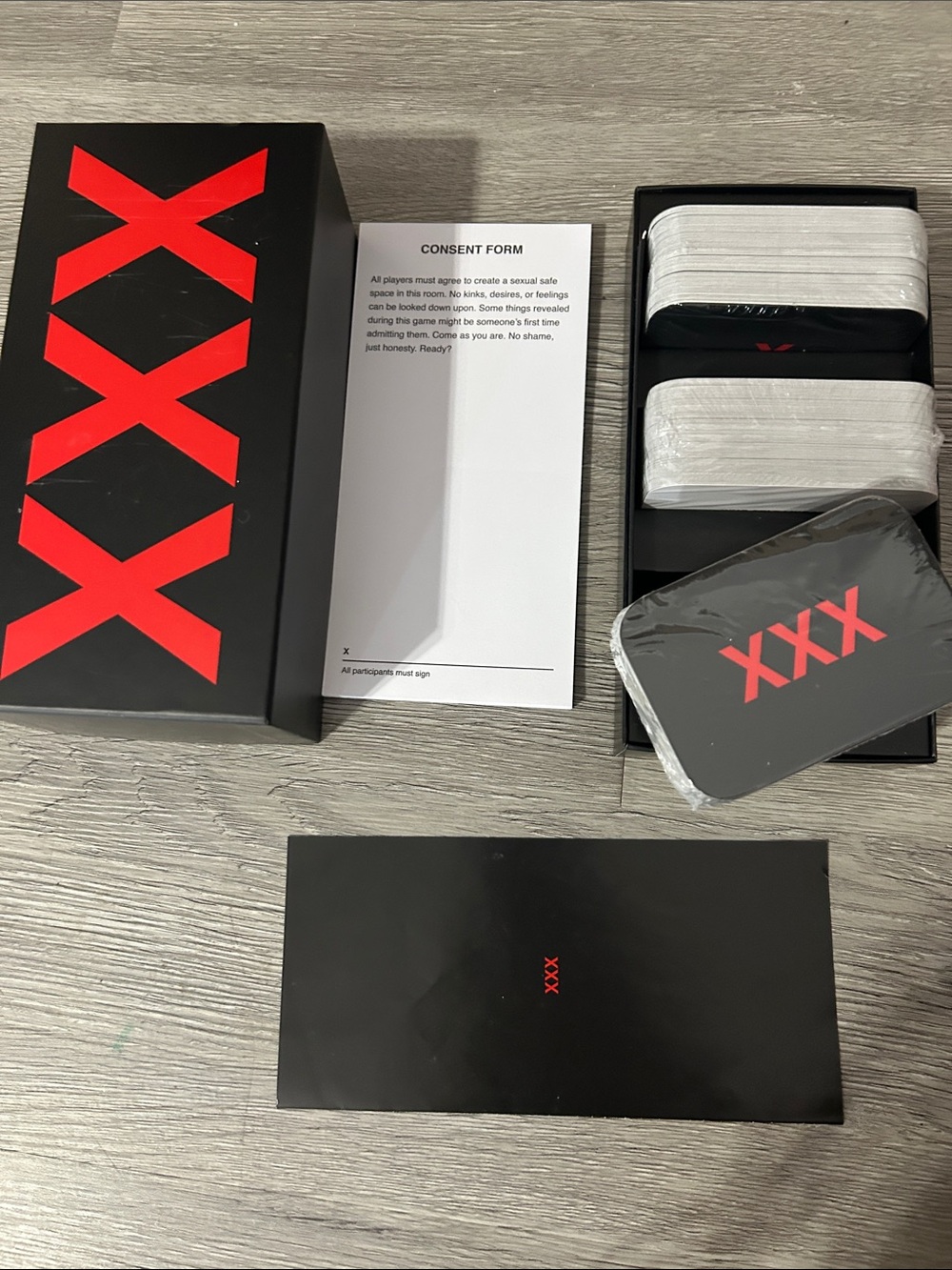 We are not really strangers Black Box Card Game Set with Red XXX Logo